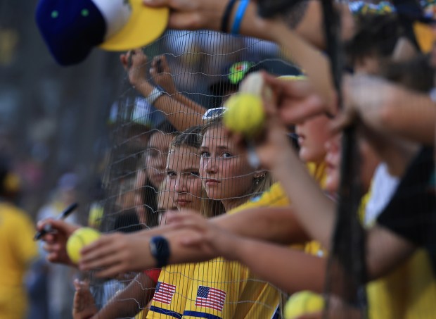Fans wait for autographs before a game between the Savannah Bananas and Firefighters on Aug. 15, 2025, at Rate Field. (John J. Kim/Chicago Tribune)