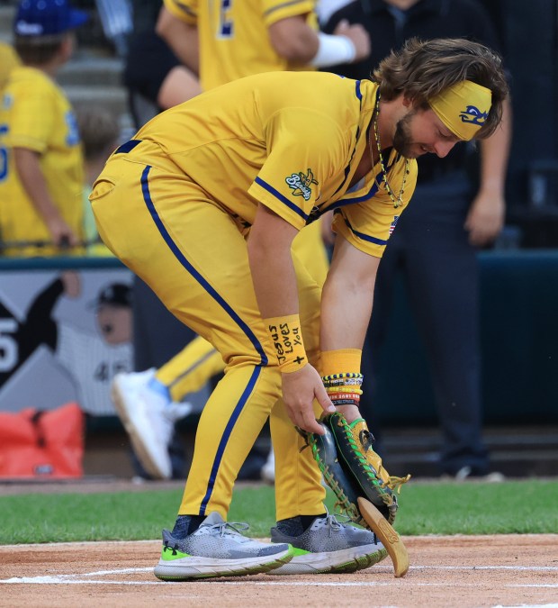 Savannah Bananas player Bill Leroy catches a banana thrown for a ceremonial first pitch before a game against the Firefighters on Aug. 15, 2025, at Rate Field. (John J. Kim/Chicago Tribune)