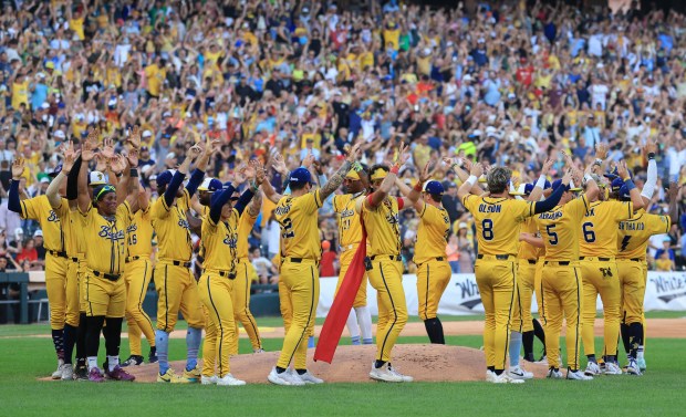 Savannah Bananas players perform a ceremony before a game against the Firefighters on Aug. 15, 2025, at Rate Field. (John J. Kim/Chicago Tribune)