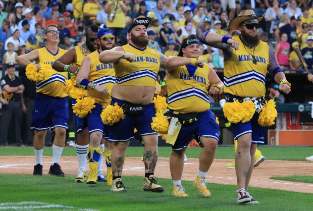 Members of the Dad Bod Cheer Squad perform before a game between the Savannah Bananas and Firefighters on Aug. 15, 2025, at Rate Field. (John J. Kim/Chicago Tribune)