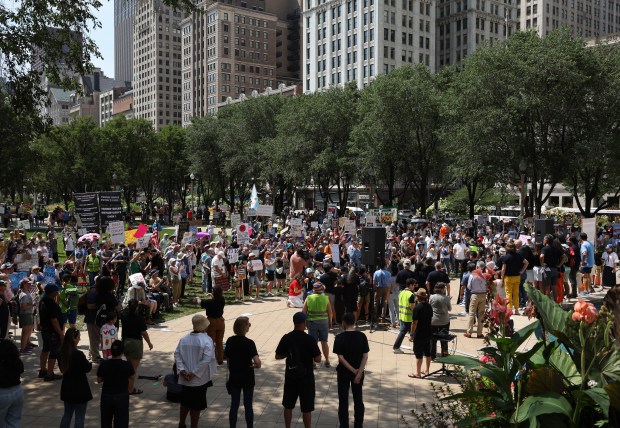 Demonstrators attend a rally in support of Texas House Democrats...