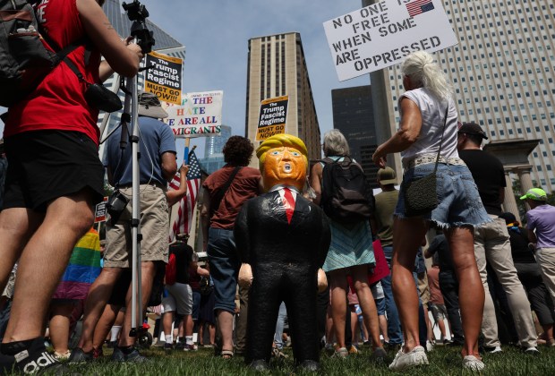 A piñata shaped like Donald Trump is placed on the...