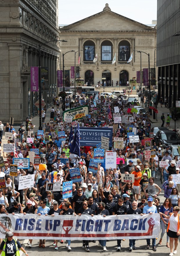 Demonstrators march in support of Texas House Democrats toward Federal...