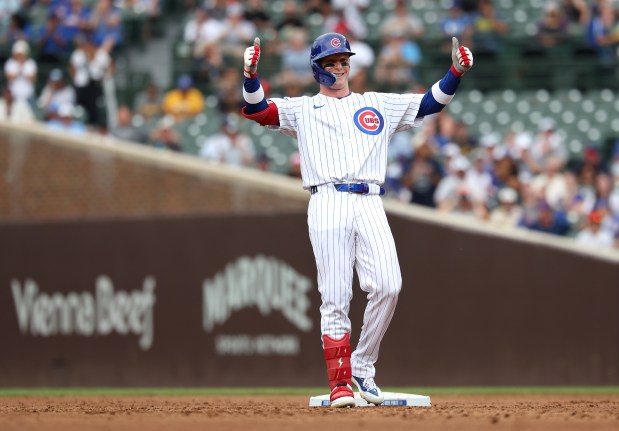 Chicago Cubs center fielder Pete Crow-Armstrong celebrates at second base after his double in the third inning of Game 1 of a doubleheader against the Milwaukee Brewers at Wrigley Field in Chicago on Aug. 19, 2025. (Chris Sweda/Chicago Tribune)
