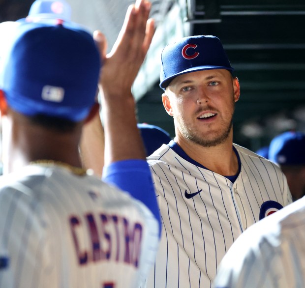 Chicago Cubs starting pitcher Jameson Taillon is congratulated by his teammates in the dugout after shutting down the Milwaukee Brewers in the sixth inning of Game 2 of a doubleheader at Wrigley Field in Chicago on Aug. 19, 2025. (Chris Sweda/Chicago Tribune)