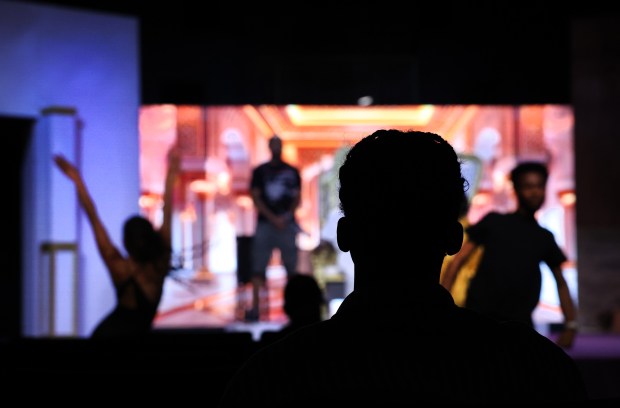Marketing assistant apprentice Andrew Carr, 21, looks on as performers...