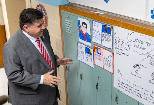 Gov. JB Pritzker comments on art and letters for him from students, Aug. 29, 2025, during his visit to Wagoner Elementary School in Sauk Village. (Dominic Di Palermo/ Chicago Tribune)