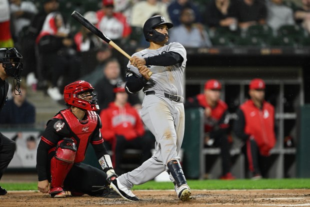 Yankees center fielder Trent Grisham hits a grand slam in front of White Sox catcher Edgar Quero in the fourth inning on Aug. 29, 2025, at Rate Field. (Daniel Bartel/Getty Images)