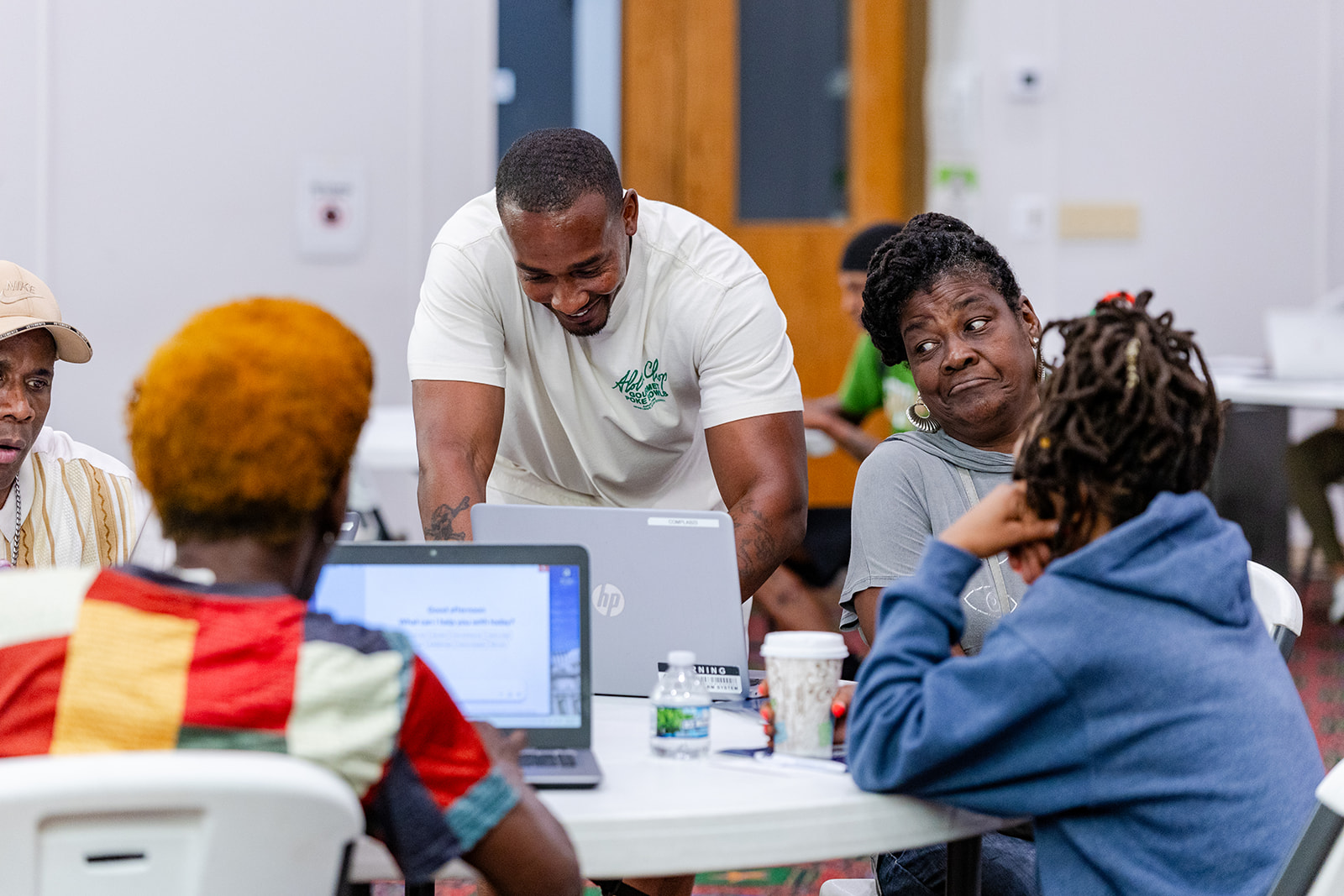 Workforce Development Manager, Maurice Goree, helping program participants during a training.