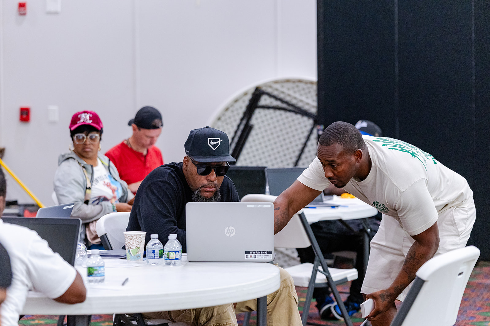 Workforce Development Manager, Maurice Goree, helping program participants during a training.