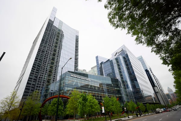 The Norfolk Southern headquarters building looms over W. Peachtree Street NE in Atlanta on Tuesday, April 4, 2023; its distinctive logo stands from any angle of the street. (Miguel Martinez/AJC)