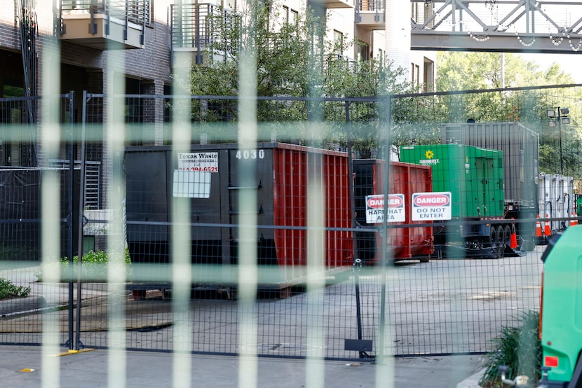 Barricades and dumpsters are seen outside The Cooper apartment complex, Wednesday, Aug. 6,...