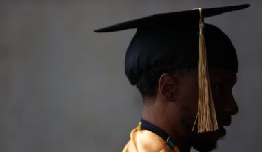 Clifton Young, a double major in business leadership and construction management, walks into the Liacouras Center in North Philadelphia before the Community College of Philadelphia commencement ceremony in May.