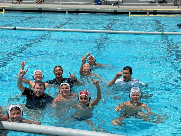 Coach Brendan Patterson, Coach Sergei Kananovich, and Coach Felipe Ferreira jump into the pool with the team after the game to celebrate the Del Mar Water Polo Club 10U national championship win.Coach Brendan Patterson, Coach Sergei Kananovich, Coach Felipe Ferreira, Armin Palaskas, Kaiwen Liu, Yuri Kananovich, Brayden Lu, Benedek McCollum, Henry LeClair, Logan Link (Photo by Coach Heather Calvin)