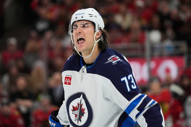 Winnipeg Jets left wing Brandon Tanev argues with an official during game against the Chicago Blackhawks, Saturday, April 12, 2025, in Chicago.