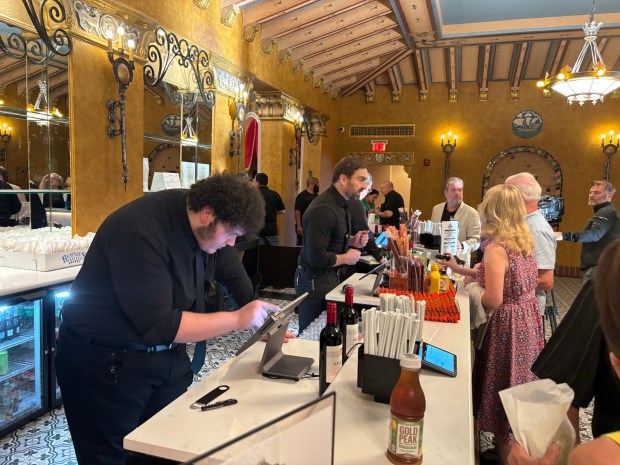 The concession stand was a flurry of activity at the opening night at the Lansdowne Theater Friday. (KATHLEEN E. CAREY - DAILY TIMES)