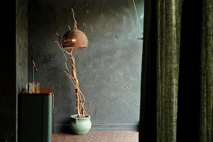 Sauvage is cloaked in olive-colored drapes that keep out the bustle on Dallas' Commerce...