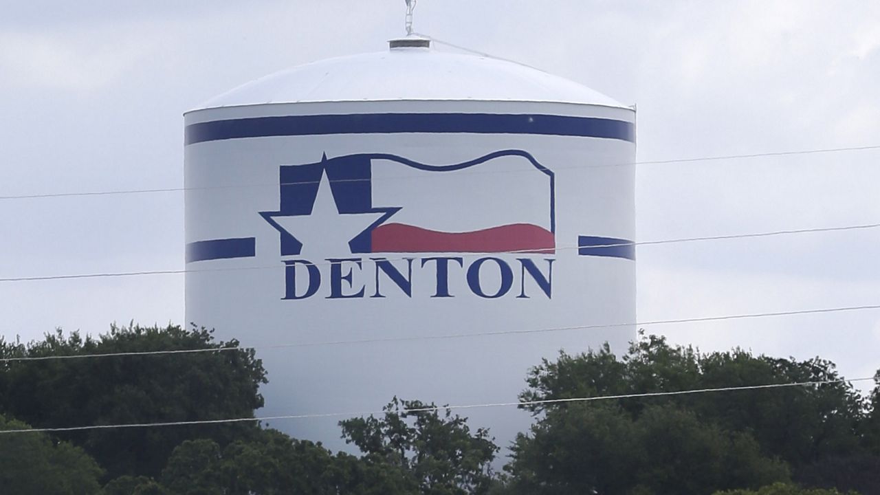 A water tank is adorned with a Texas flag and city theme in Denton, Texas, Thursday, May 29, 2014. (AP Photo/LM Otero)