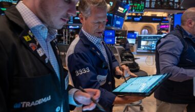 Traders work on the floor of the New York Stock Exchange in April 2025.