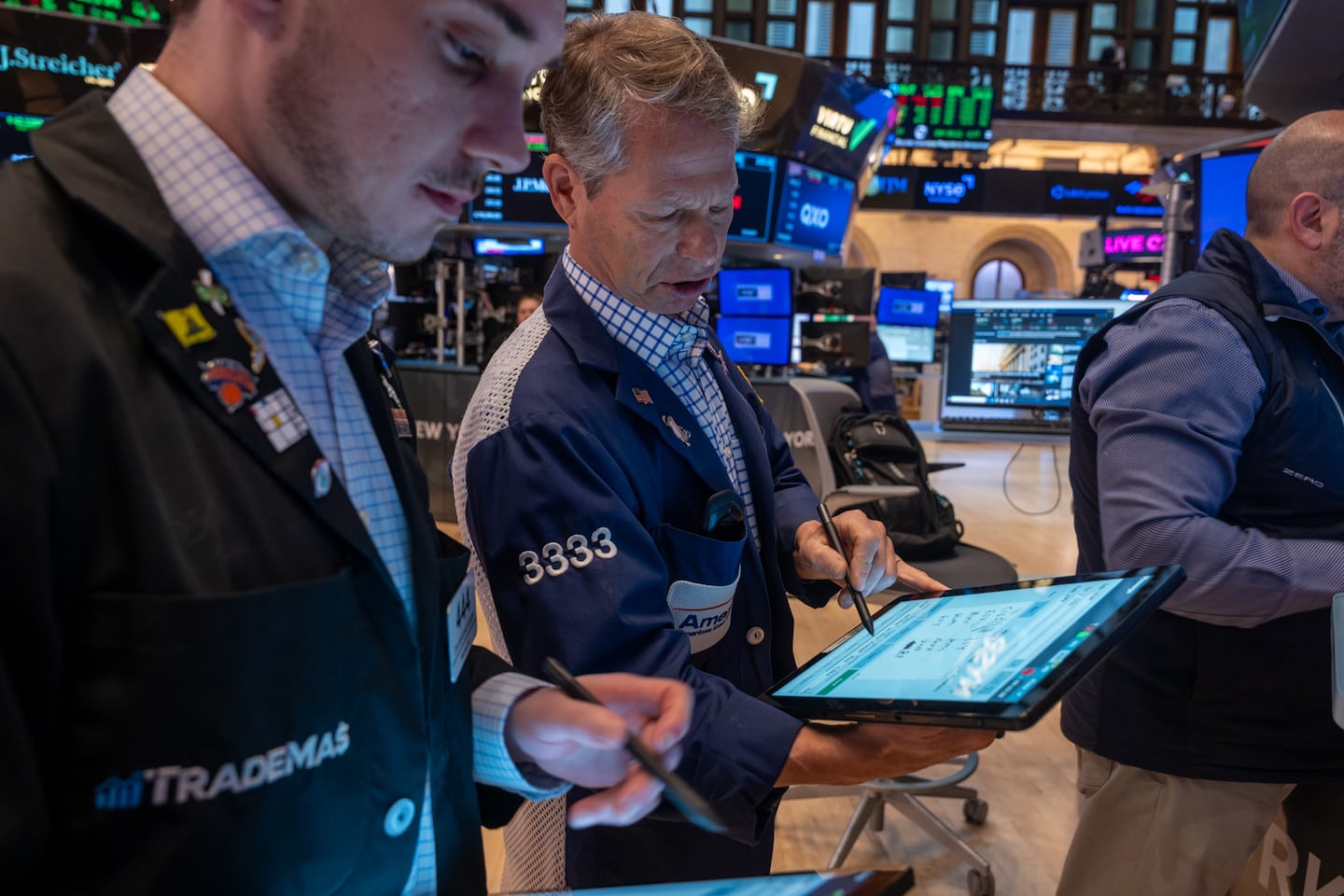 Traders work on the floor of the New York Stock Exchange in April 2025.