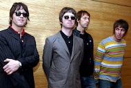 FILE - Members of British rock band Oasis pose for photos ahead of a concert in Hong Kong,...