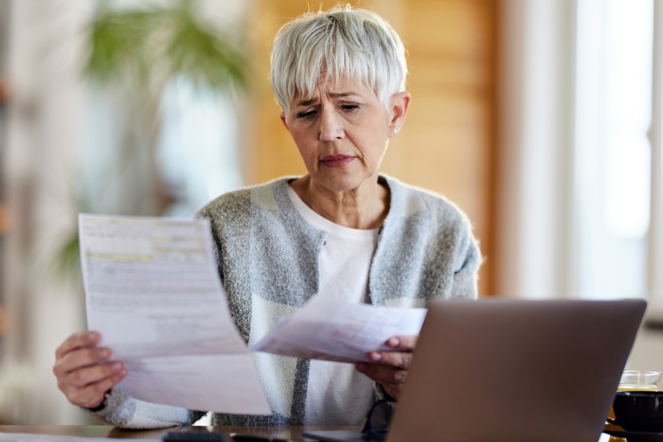 Woman reviewing bills.