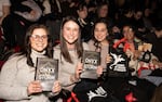 FILE- Audience members attend author Rebecca Yarros in conversation of her new book "Onyx Storm" at The Town Hall on Friday, Jan. 24, 2025, in New York.