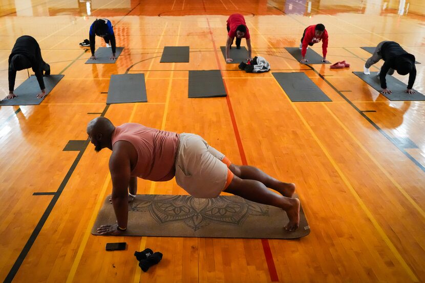 Dulani Stephens of Dauntless Source leads teens in a yoga session during Mindful Kings a...