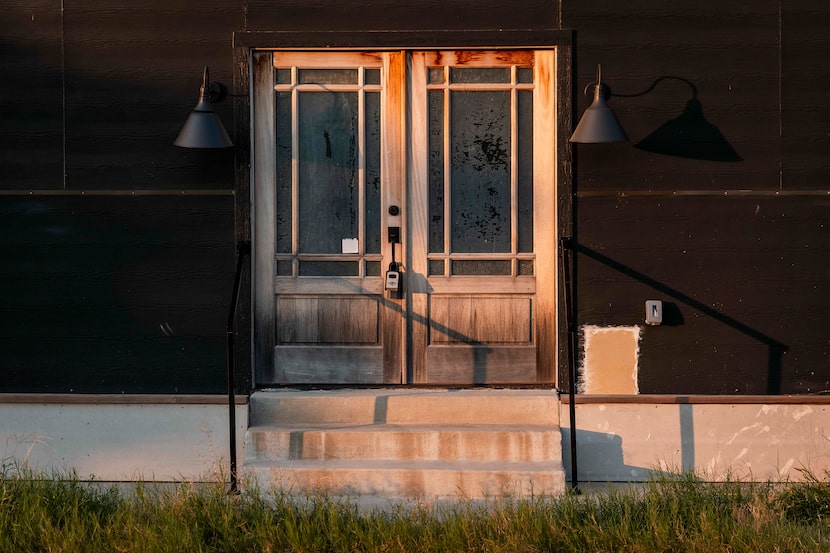 A lockbox is seen on a doorway to a 5-story, 4,293 square foot, unfinished townhouse at 1401...