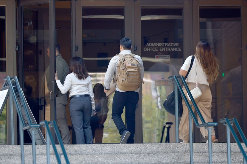 People attend a career expo for U.S. Immigration and Customs Enforcement at Esports Stadium,...