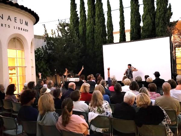 Each "Flicks on the Bricks" screening will begin at 8 p.m. Guests can order wine or compete in weekly trivia games before the sun goes down. (Athenaeum Music & Arts Library)