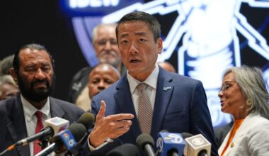 Democratic Texas Rep. Gene Wu, center, surrounded by other Texas House Democrats and Democratic members of Congress, speaks during a press conference at the Democratic Party in Warrenville, Ill., Monday, Aug. 4, 2025. (AP Photo/Nam Y. Huh)