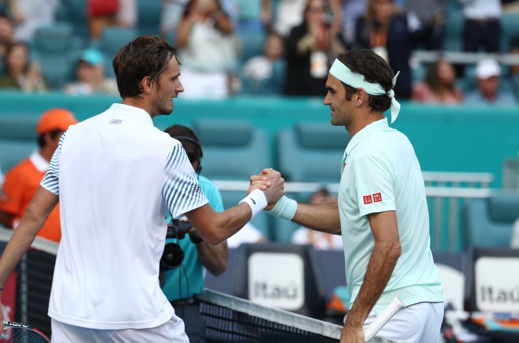 Daniil Medvedev and Roger Federer shake hands at the Miami Open in 2019.