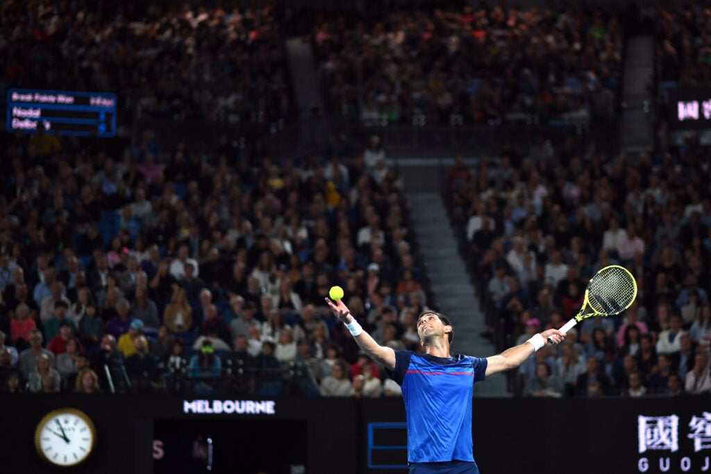 Federico Delbonis serves against Spain's Rafael Nadal during their men's singles match on day four of the Australian Open tennis tournament in Melbourne.