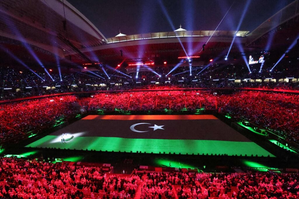 The Libyan flag is projected on the pitch during the opening ceremony of the FIFA Arab Cup 2021