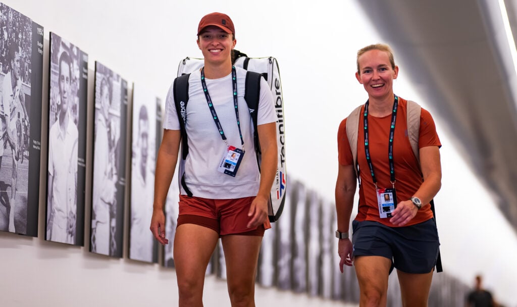 Iga Swiatek and Daria Abramowicz walking to practice together at the 2025 Italian Open