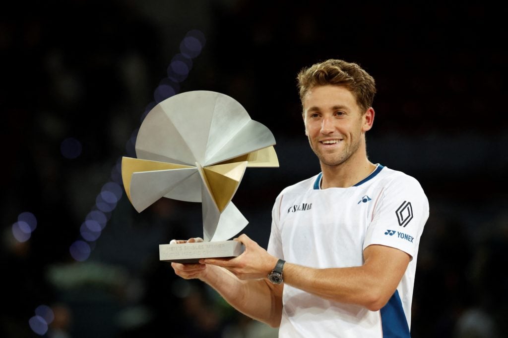 Casper Ruud poses with the Madrid Open trophy after beating Jack Draper in the final