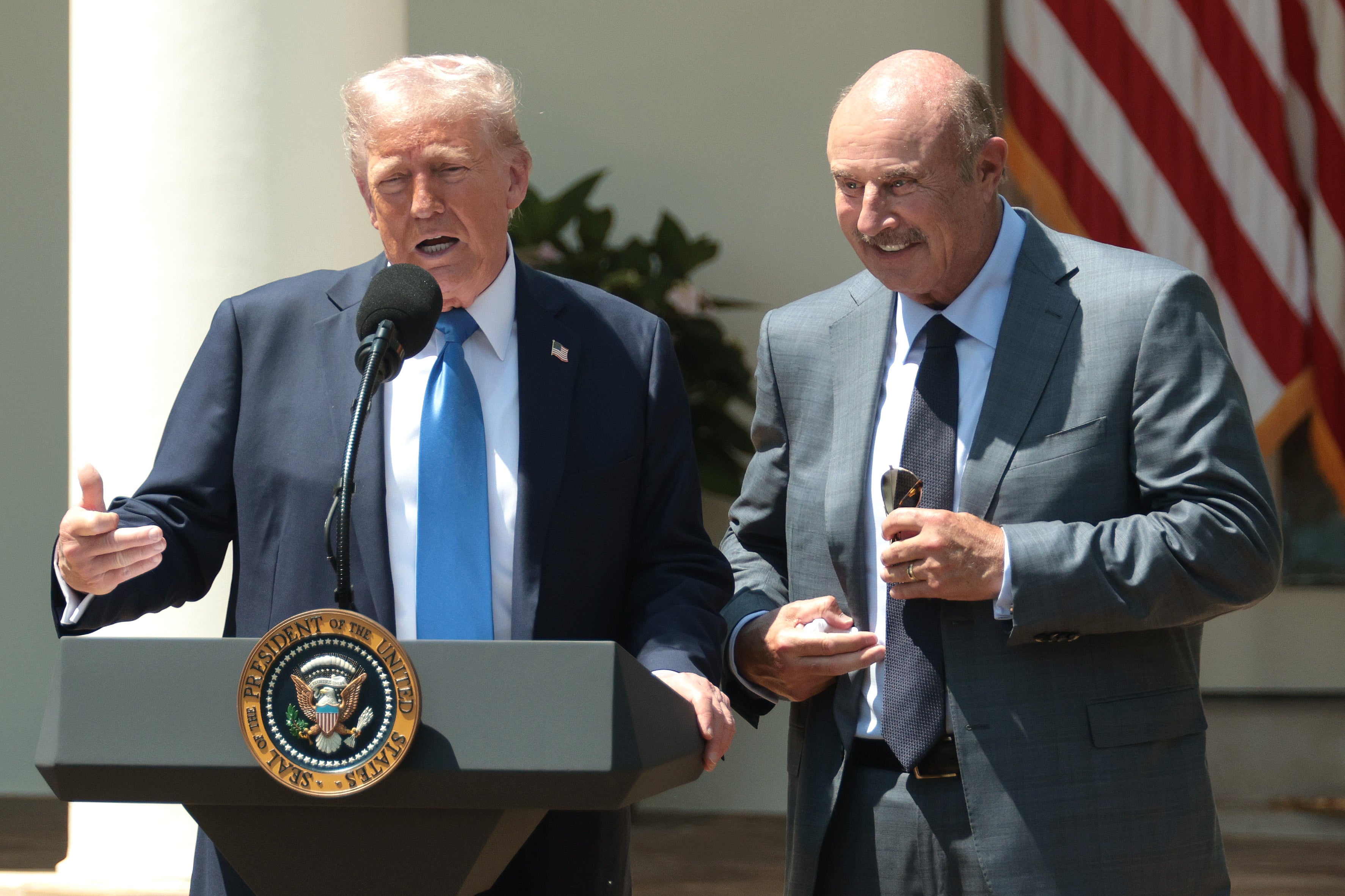 Dr. Phil, seen here with President Donald Trump, appeared on Real Time with Bill Maher on Friday night
