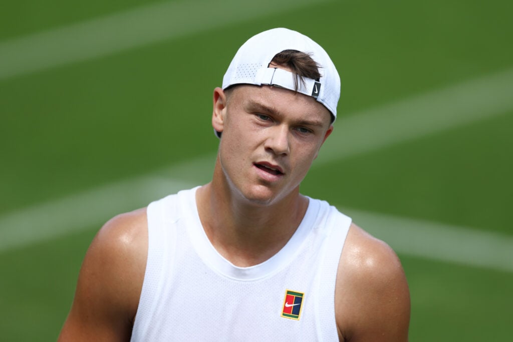 Holger Rune of Denmark looks on during a practice session prior to The Championships Wimbledon 2025 at All England Lawn Tennis and Croquet Club.