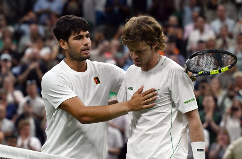 Carlos Alcaraz and Andrey Rublev at the net after their fourth-round match at Wimbledon.