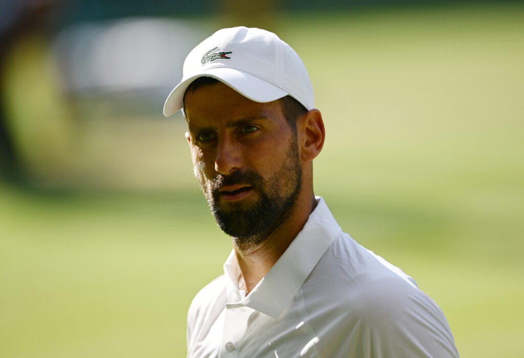 Novak Djokovic looks on during his defeat to Jannik Sinner at Wimbledon in 2025