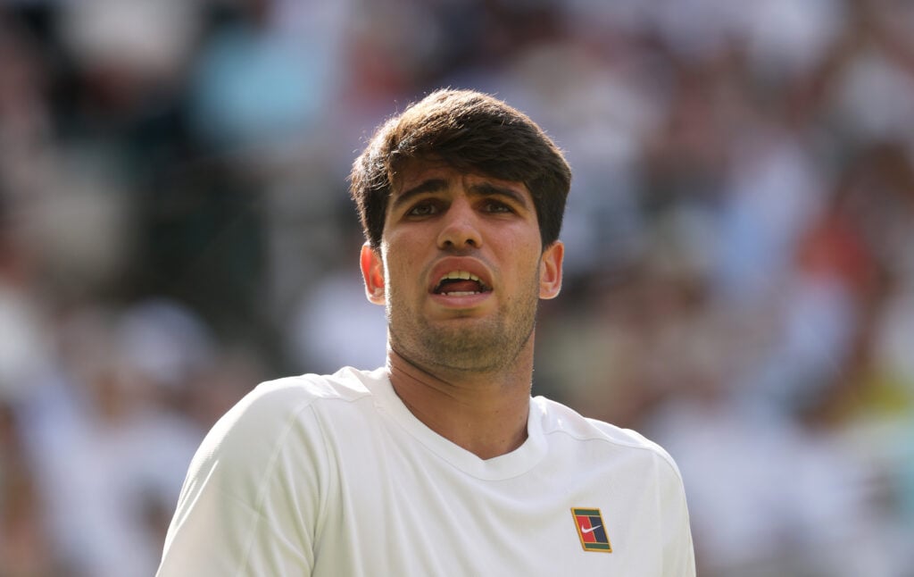 Carlos Alcaraz looks towards his team during the 2025 Wimbledon Championships