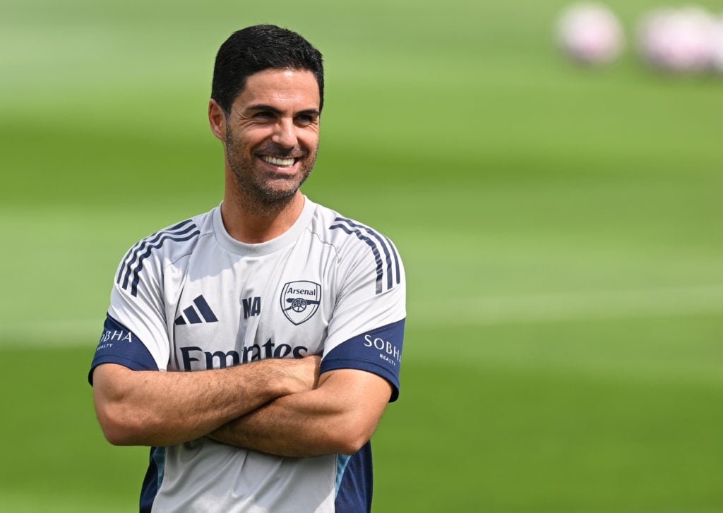 Mikel Arteta smiles during an Arsenal training session