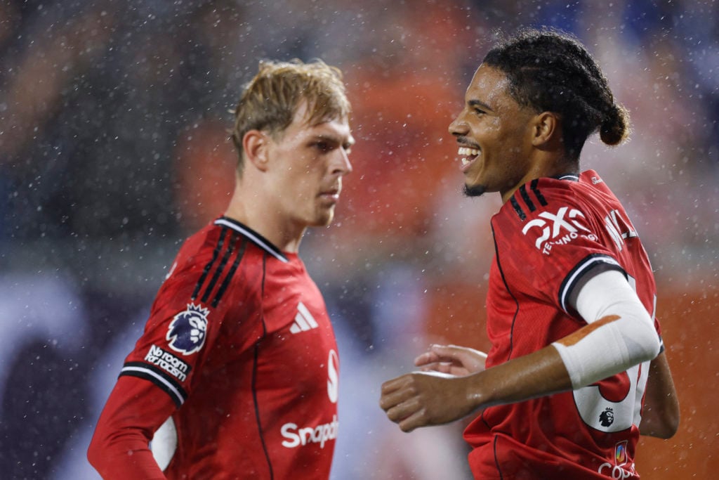 Ethan Williams celebrates his goal, with Toby Collyer