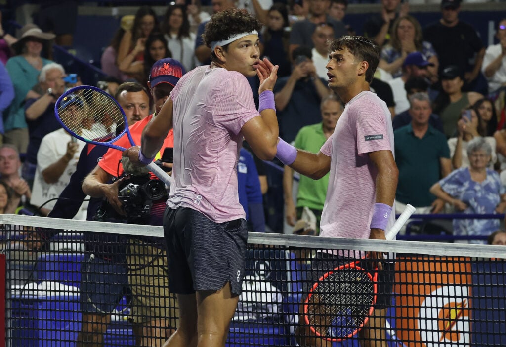 Ben Shelton of the United States and Flavio Cobolli of Italy discuss an aspect of the match after their game in the round of 16 on Centre Court at the National Bank Open at Sobeys Stadium in Toronto.