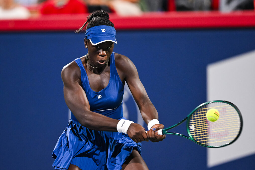 Victoria Mboko (CAN) returns the ball during a quarterfinal match at WTA National Bank Open on August 04, 2025 at IGA Stadium in Montreal, QC