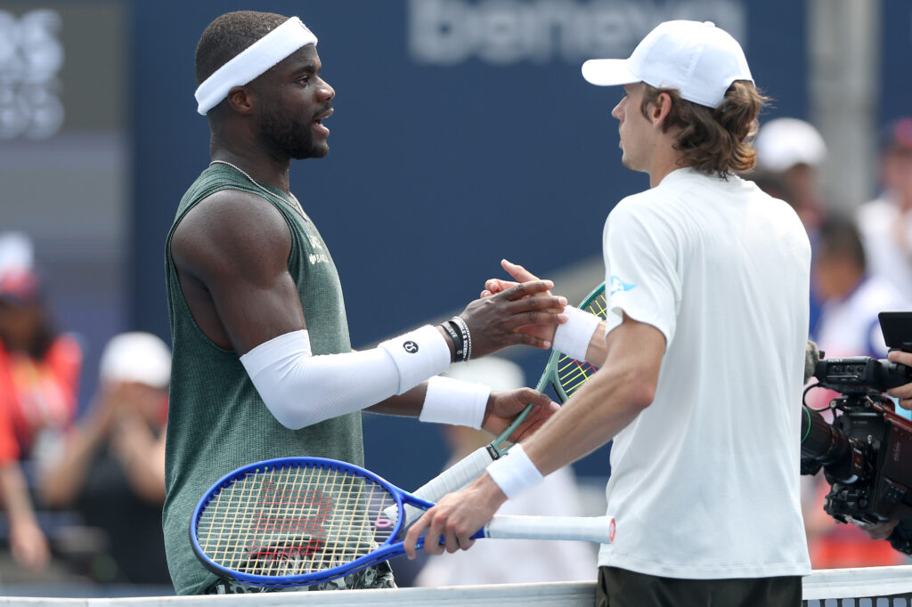 Frances Tiafoe and Alex de Minaur shake hands at the net