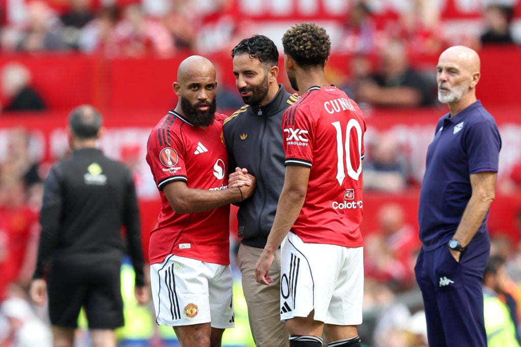 Bryan Mbeumo and Matheus Cunha interact with Ruben Amorim during the pre-season friendly match between Manchester United and Fiorentina at Old Trafford in 2025 in Manchester, England.