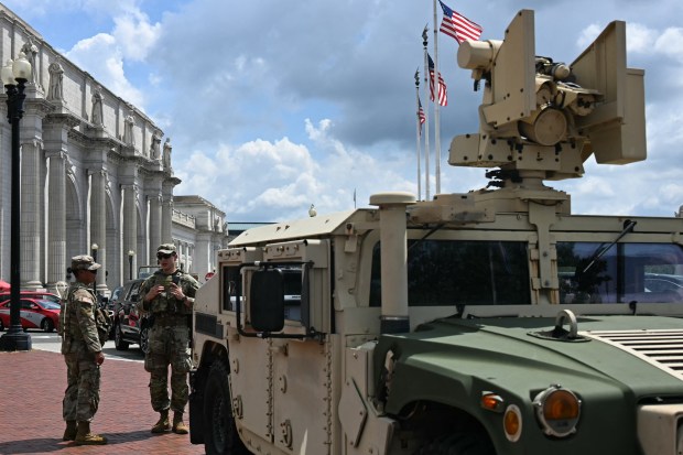 Members of the US National Guard patrol in front of Union Station in Washington, DC, on August 14, 2025. (Photo by JIM WATSON/AFP via Getty Images)