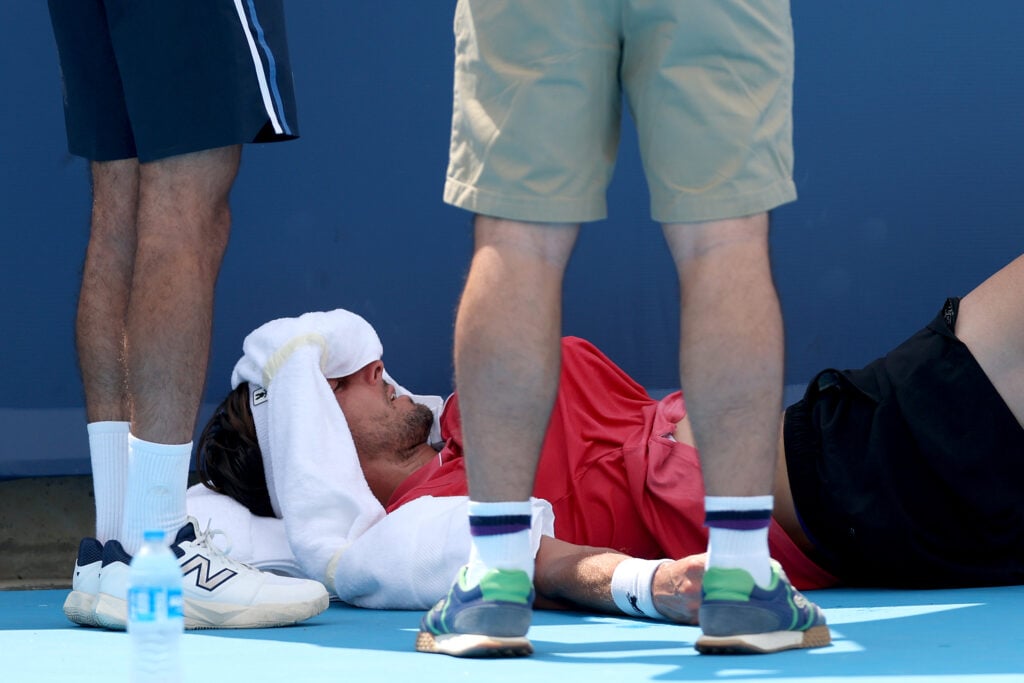 Arthur Rinderknech lies down on court during his third-round match at the 2025 Cincinnati Open